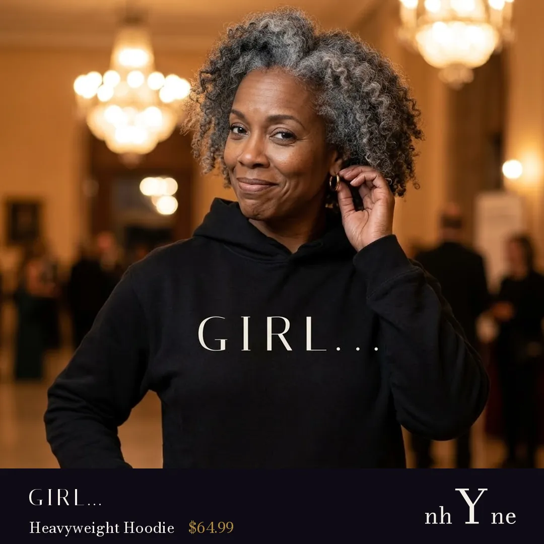 A woman with silver hair in a black GIRL… hoodie